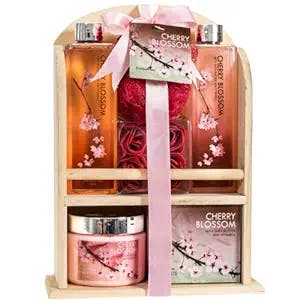 Home Spa Gift Basket - Deluxe Cherry Blossom Fragrance - Luxury Bath & Body Set For Women - Contains Shower Gel, Bubble Bath, Bath Salts, Body Lotion, Bath Puff, Pink Bath Rose Soaps in Wooden Curio